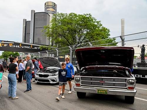 Fans look at cars and engines at Cruise Night