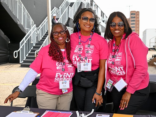 A group of volunteers smile