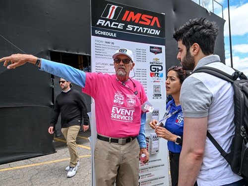 A volunteer gives directions