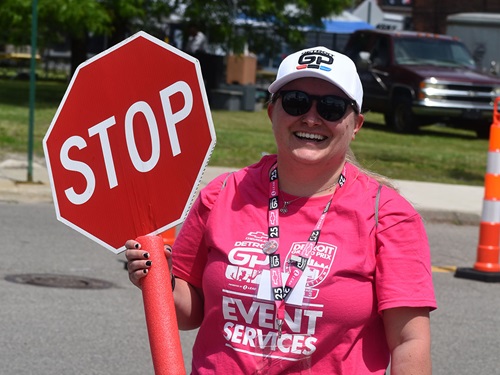 A volunteer controls traffic