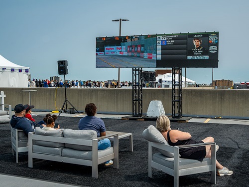 Fans watch a screen on the roof